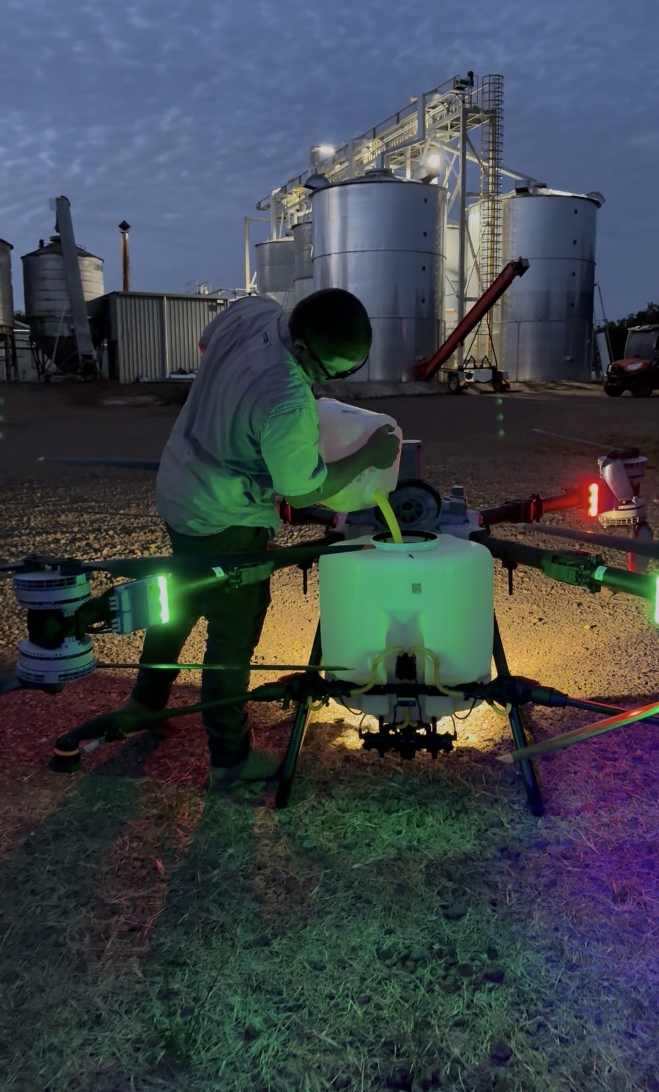 Loading fluorescent dye into the spray tank at dusk